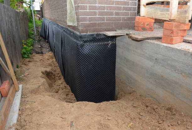Happy homeowners after waterproofing job in Wyncote
